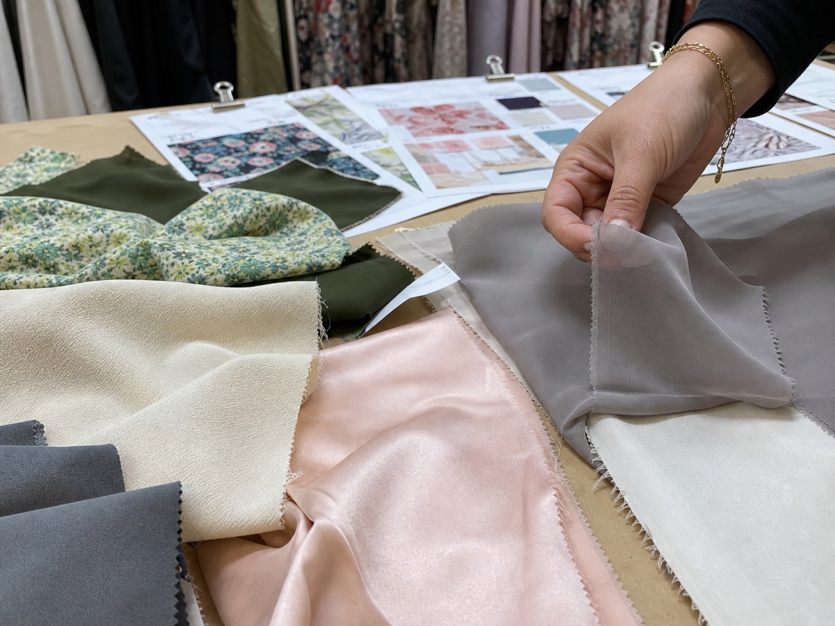 Garment fabric swatches reviewed for drape, sheen, and opacity